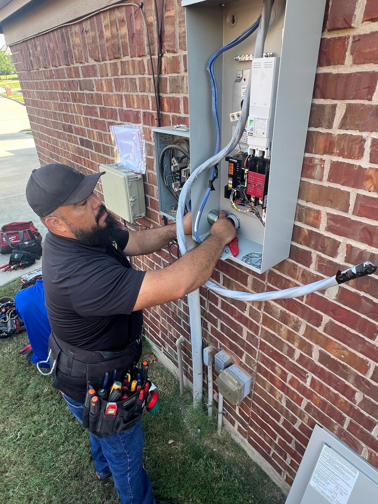 Electrician Working on Electrical Panel